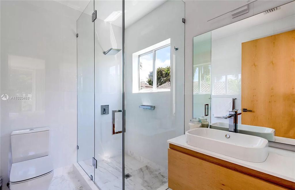 The Modern Waterfront Villa in Miami Beach is a luxurious home on Pine Tree Drive ideal for entertaining now available for sale. This home located at 5711 Pine Tree Dr, Miami Beach, Florida; offering 7 bedrooms and 9 bathrooms with over 8,000 square feet of living spaces.
