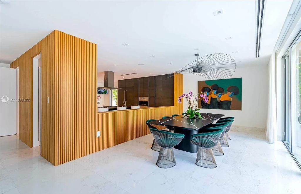 The Modern Waterfront Villa in Miami Beach is a luxurious home on Pine Tree Drive ideal for entertaining now available for sale. This home located at 5711 Pine Tree Dr, Miami Beach, Florida; offering 7 bedrooms and 9 bathrooms with over 8,000 square feet of living spaces.