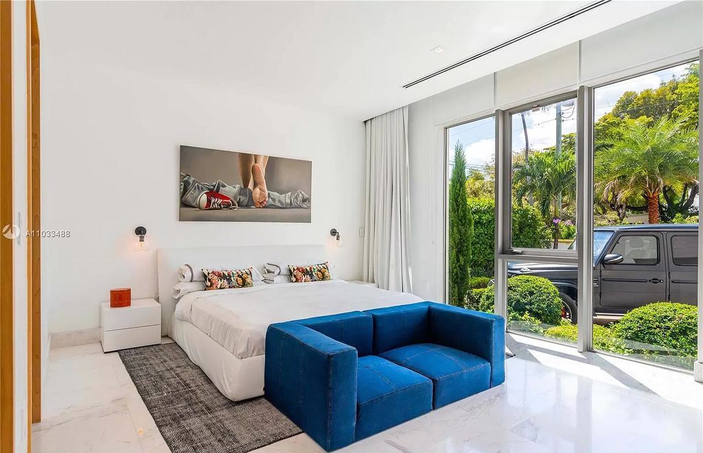 The Modern Waterfront Villa in Miami Beach is a luxurious home on Pine Tree Drive ideal for entertaining now available for sale. This home located at 5711 Pine Tree Dr, Miami Beach, Florida; offering 7 bedrooms and 9 bathrooms with over 8,000 square feet of living spaces.