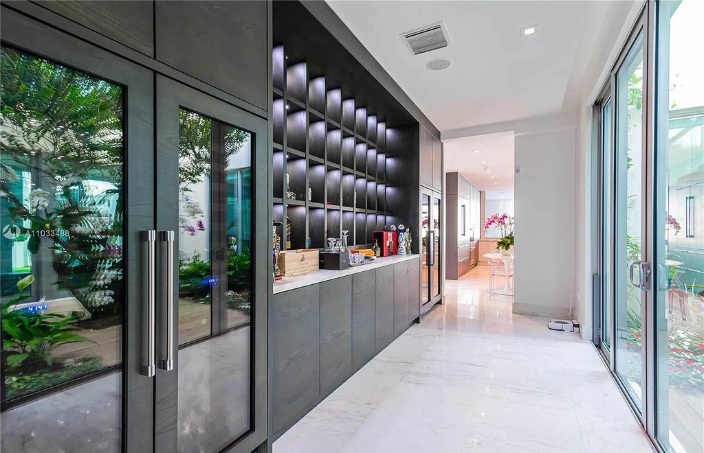 The Modern Waterfront Villa in Miami Beach is a luxurious home on Pine Tree Drive ideal for entertaining now available for sale. This home located at 5711 Pine Tree Dr, Miami Beach, Florida; offering 7 bedrooms and 9 bathrooms with over 8,000 square feet of living spaces.