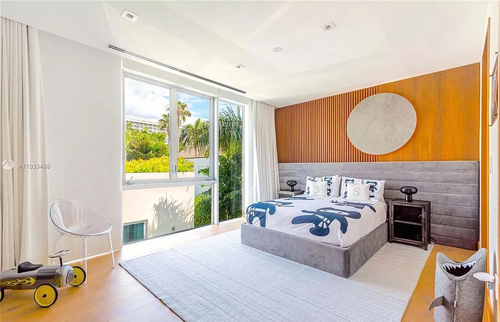 The Modern Waterfront Villa in Miami Beach is a luxurious home on Pine Tree Drive ideal for entertaining now available for sale. This home located at 5711 Pine Tree Dr, Miami Beach, Florida; offering 7 bedrooms and 9 bathrooms with over 8,000 square feet of living spaces.