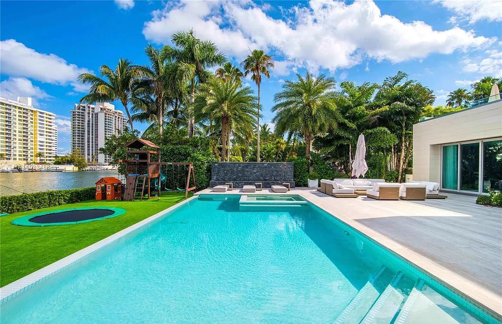 The Modern Waterfront Villa in Miami Beach is a luxurious home on Pine Tree Drive ideal for entertaining now available for sale. This home located at 5711 Pine Tree Dr, Miami Beach, Florida; offering 7 bedrooms and 9 bathrooms with over 8,000 square feet of living spaces.