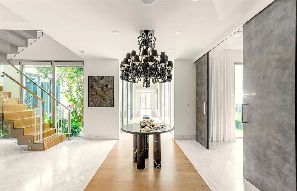 The Modern Waterfront Villa in Miami Beach is a luxurious home on Pine Tree Drive ideal for entertaining now available for sale. This home located at 5711 Pine Tree Dr, Miami Beach, Florida; offering 7 bedrooms and 9 bathrooms with over 8,000 square feet of living spaces.