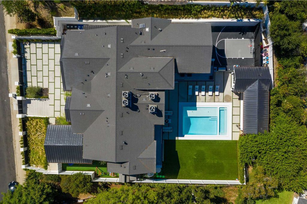 The Modern Farmhouse in Encino is a marvel at the grand scale, gorgeous fixtures, layered textures, and sleek design now available for sale. This home located at 17015 Adlon Rd, Encino, California; offering 6 bedrooms and 10 bathrooms with over 8,900 square feet of living spaces. 