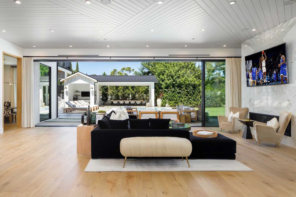 The Modern Farmhouse in Encino is a marvel at the grand scale, gorgeous fixtures, layered textures, and sleek design now available for sale. This home located at 17015 Adlon Rd, Encino, California; offering 6 bedrooms and 10 bathrooms with over 8,900 square feet of living spaces. 