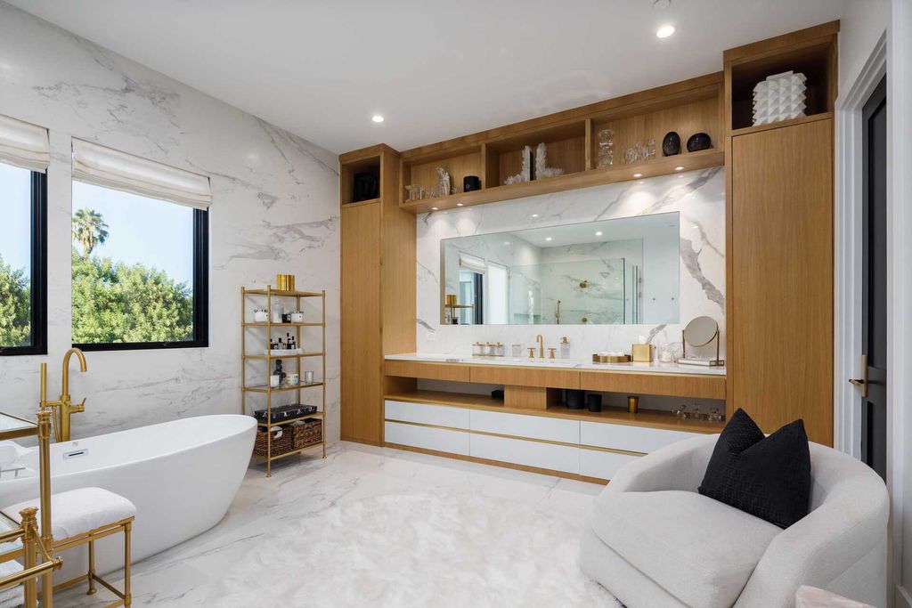 The Modern Farmhouse in Encino is a marvel at the grand scale, gorgeous fixtures, layered textures, and sleek design now available for sale. This home located at 17015 Adlon Rd, Encino, California; offering 6 bedrooms and 10 bathrooms with over 8,900 square feet of living spaces. 