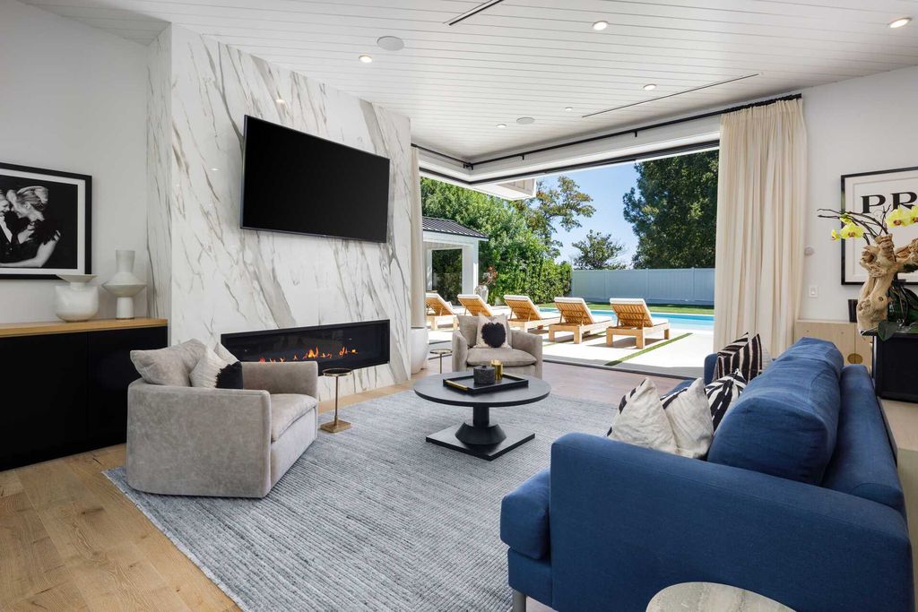 The Modern Farmhouse in Encino is a marvel at the grand scale, gorgeous fixtures, layered textures, and sleek design now available for sale. This home located at 17015 Adlon Rd, Encino, California; offering 6 bedrooms and 10 bathrooms with over 8,900 square feet of living spaces. 