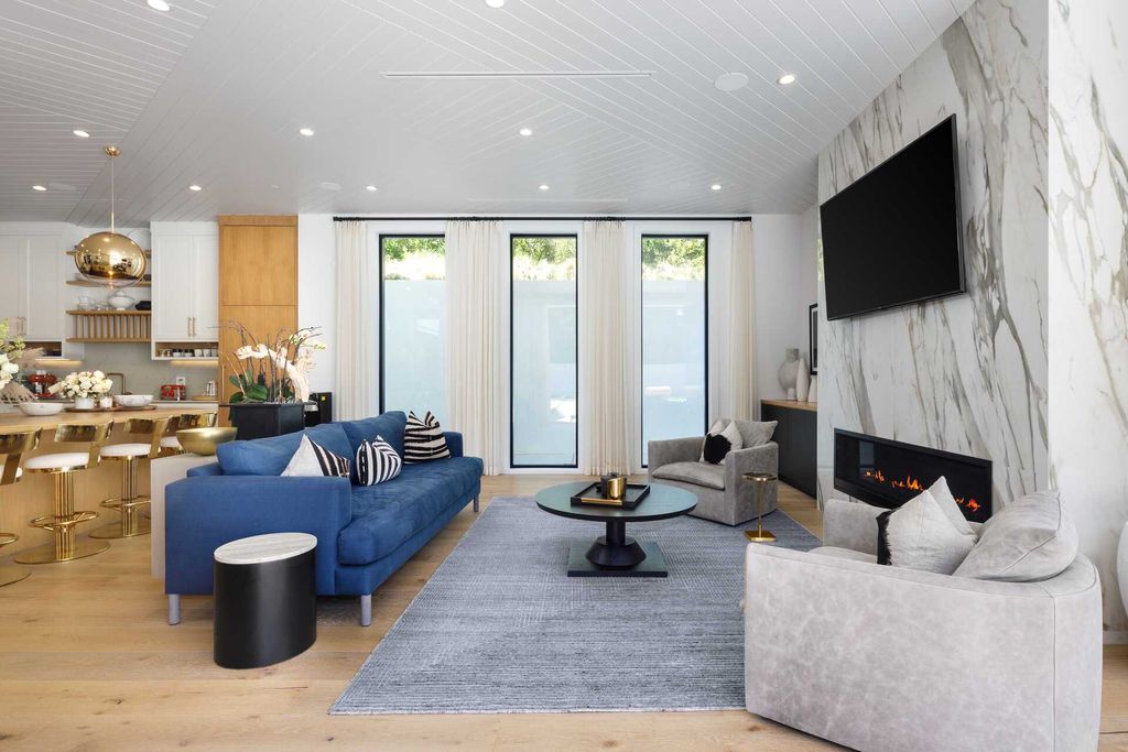 The Modern Farmhouse in Encino is a marvel at the grand scale, gorgeous fixtures, layered textures, and sleek design now available for sale. This home located at 17015 Adlon Rd, Encino, California; offering 6 bedrooms and 10 bathrooms with over 8,900 square feet of living spaces. 