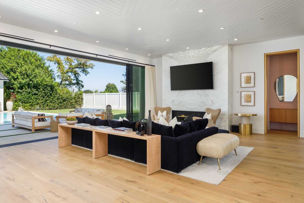 The Modern Farmhouse in Encino is a marvel at the grand scale, gorgeous fixtures, layered textures, and sleek design now available for sale. This home located at 17015 Adlon Rd, Encino, California; offering 6 bedrooms and 10 bathrooms with over 8,900 square feet of living spaces. 