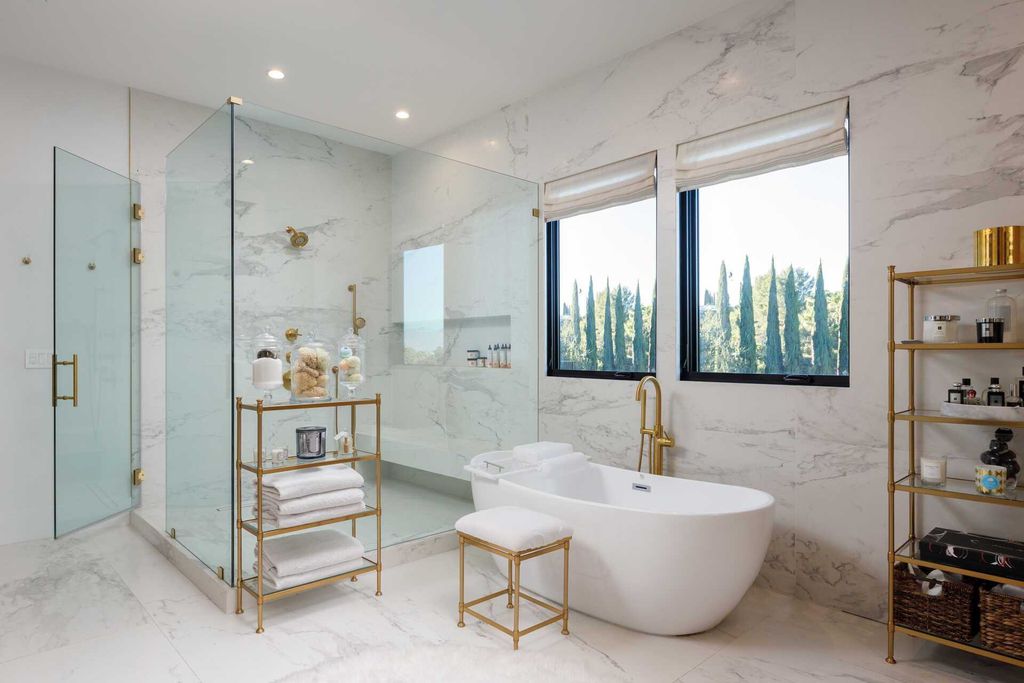 The Modern Farmhouse in Encino is a marvel at the grand scale, gorgeous fixtures, layered textures, and sleek design now available for sale. This home located at 17015 Adlon Rd, Encino, California; offering 6 bedrooms and 10 bathrooms with over 8,900 square feet of living spaces. 