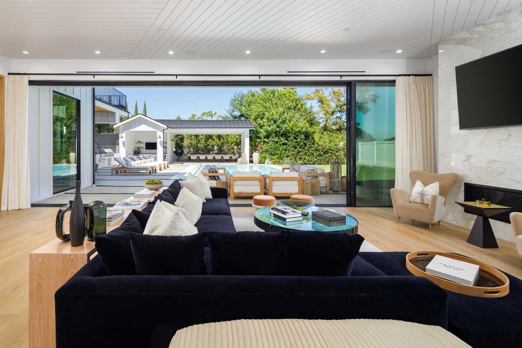 The Modern Farmhouse in Encino is a marvel at the grand scale, gorgeous fixtures, layered textures, and sleek design now available for sale. This home located at 17015 Adlon Rd, Encino, California; offering 6 bedrooms and 10 bathrooms with over 8,900 square feet of living spaces. 