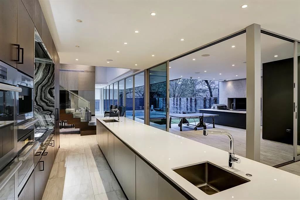 The masterful custom home in Houston offers modern contemporary detail and clean-line architecture mixed with the warmth of modern construction now available for sale. This home located at 4001 Ella Lee Ln, Houston, Texas; offering 4 bedrooms and 6 bathrooms with over 6,300 square feet of living spaces.