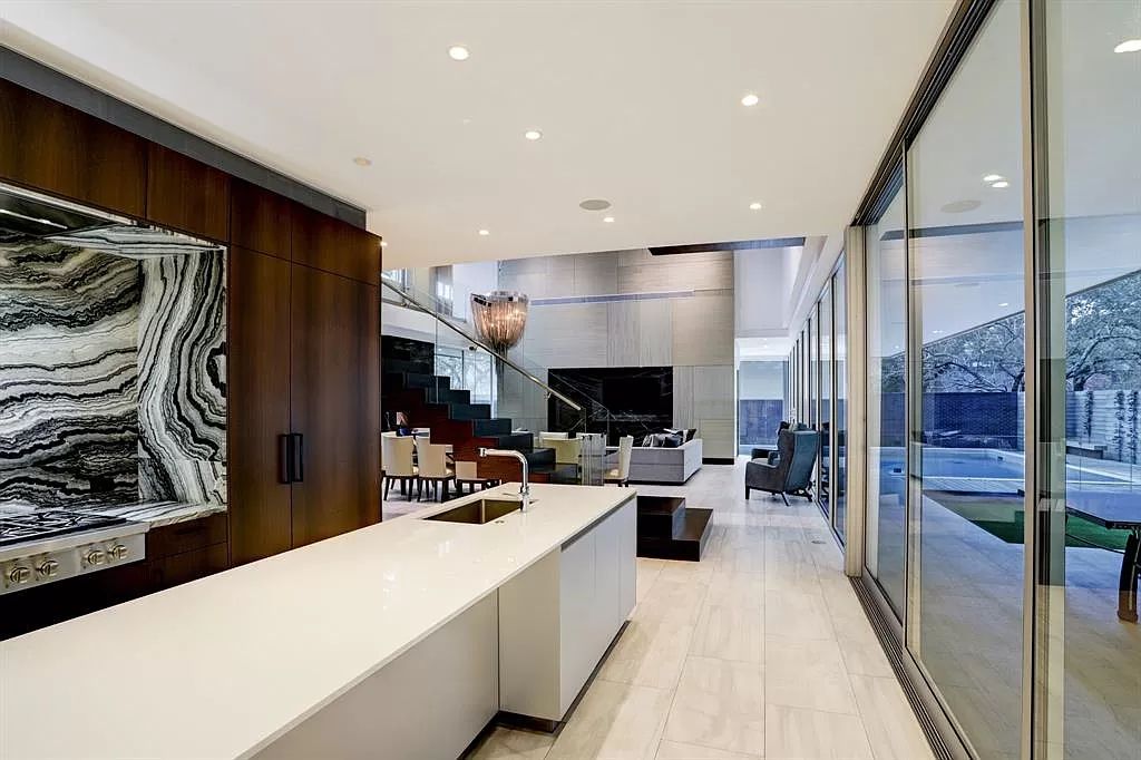 The masterful custom home in Houston offers modern contemporary detail and clean-line architecture mixed with the warmth of modern construction now available for sale. This home located at 4001 Ella Lee Ln, Houston, Texas; offering 4 bedrooms and 6 bathrooms with over 6,300 square feet of living spaces.