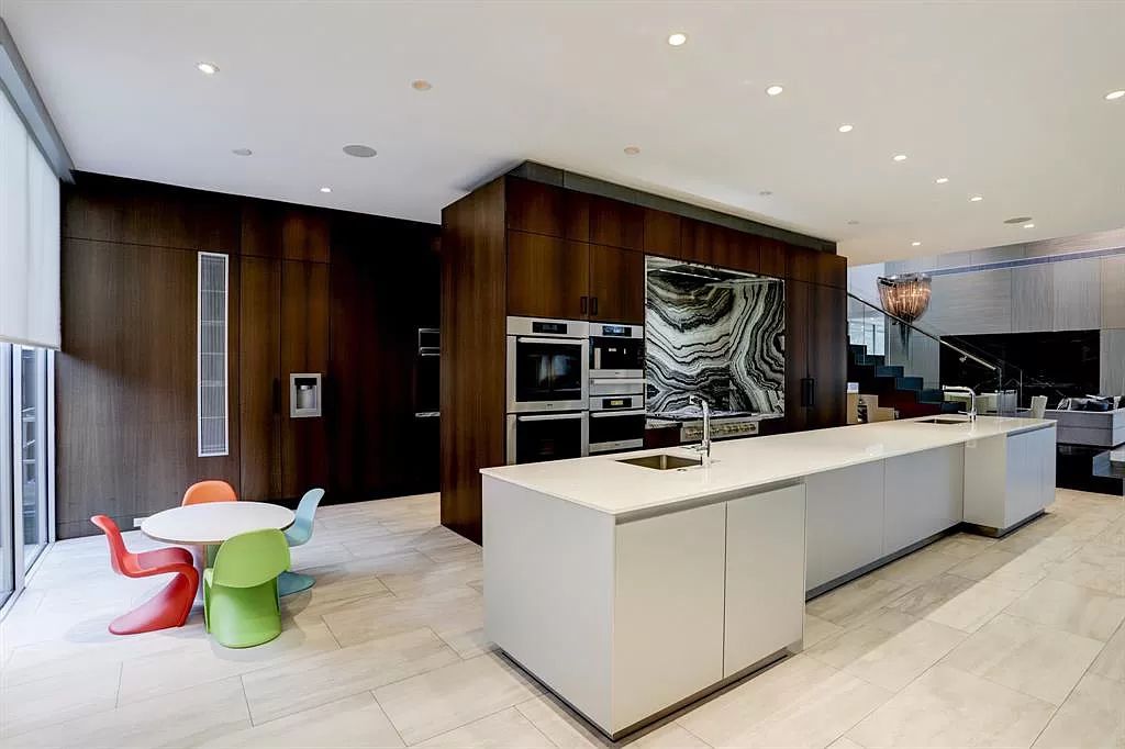 The masterful custom home in Houston offers modern contemporary detail and clean-line architecture mixed with the warmth of modern construction now available for sale. This home located at 4001 Ella Lee Ln, Houston, Texas; offering 4 bedrooms and 6 bathrooms with over 6,300 square feet of living spaces.