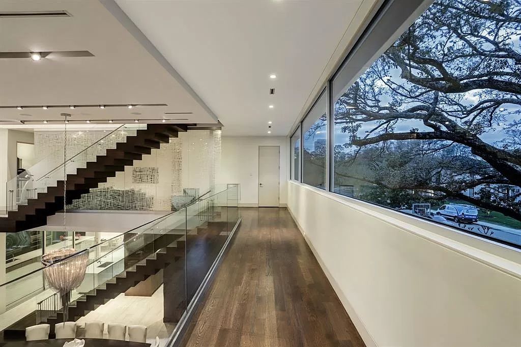 The masterful custom home in Houston offers modern contemporary detail and clean-line architecture mixed with the warmth of modern construction now available for sale. This home located at 4001 Ella Lee Ln, Houston, Texas; offering 4 bedrooms and 6 bathrooms with over 6,300 square feet of living spaces.