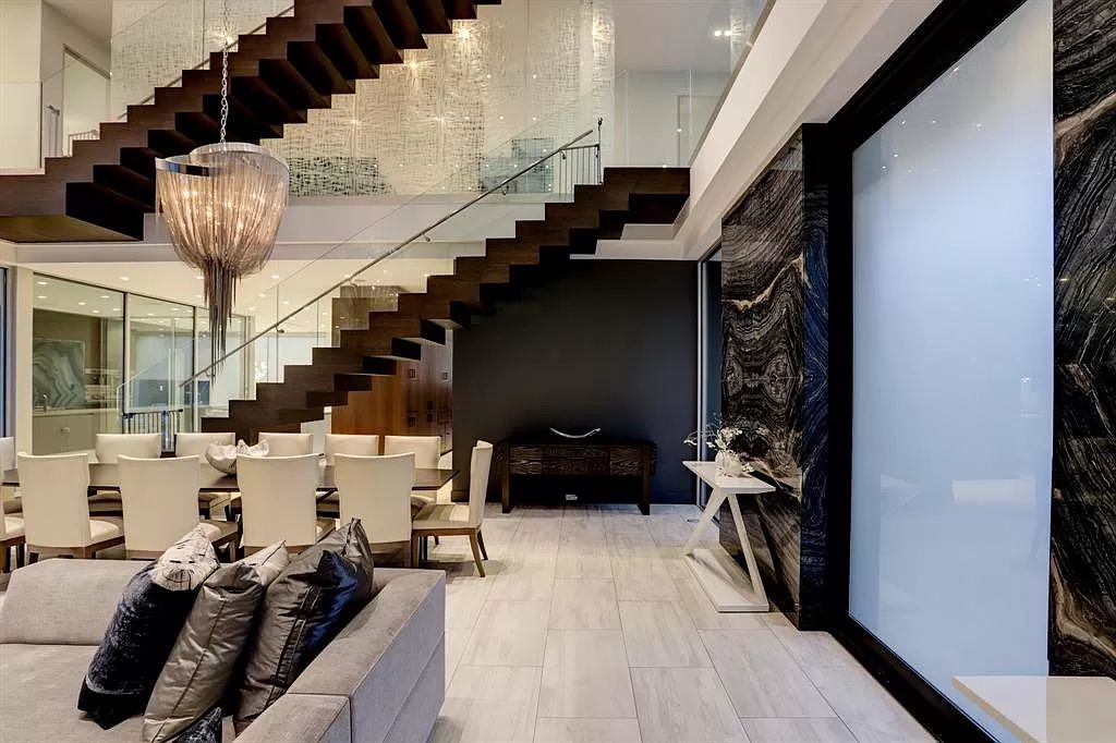 The masterful custom home in Houston offers modern contemporary detail and clean-line architecture mixed with the warmth of modern construction now available for sale. This home located at 4001 Ella Lee Ln, Houston, Texas; offering 4 bedrooms and 6 bathrooms with over 6,300 square feet of living spaces.