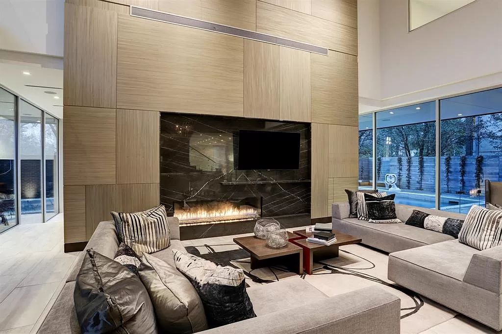 The masterful custom home in Houston offers modern contemporary detail and clean-line architecture mixed with the warmth of modern construction now available for sale. This home located at 4001 Ella Lee Ln, Houston, Texas; offering 4 bedrooms and 6 bathrooms with over 6,300 square feet of living spaces.