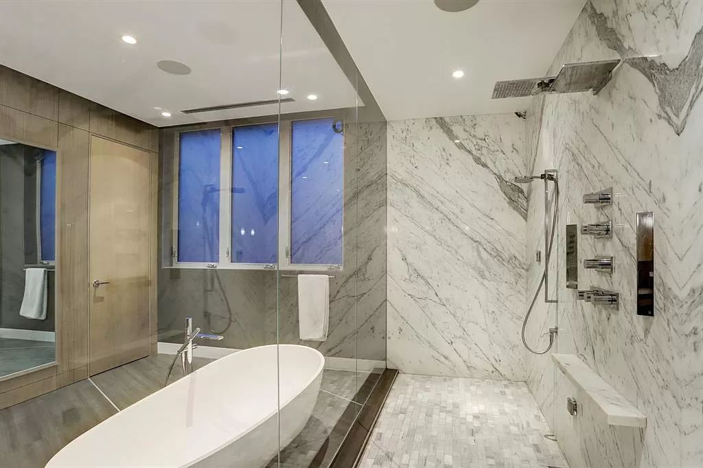 The masterful custom home in Houston offers modern contemporary detail and clean-line architecture mixed with the warmth of modern construction now available for sale. This home located at 4001 Ella Lee Ln, Houston, Texas; offering 4 bedrooms and 6 bathrooms with over 6,300 square feet of living spaces.