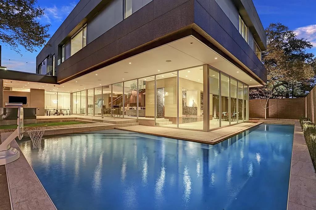 The masterful custom home in Houston offers modern contemporary detail and clean-line architecture mixed with the warmth of modern construction now available for sale. This home located at 4001 Ella Lee Ln, Houston, Texas; offering 4 bedrooms and 6 bathrooms with over 6,300 square feet of living spaces.