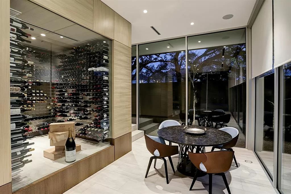 The masterful custom home in Houston offers modern contemporary detail and clean-line architecture mixed with the warmth of modern construction now available for sale. This home located at 4001 Ella Lee Ln, Houston, Texas; offering 4 bedrooms and 6 bathrooms with over 6,300 square feet of living spaces.