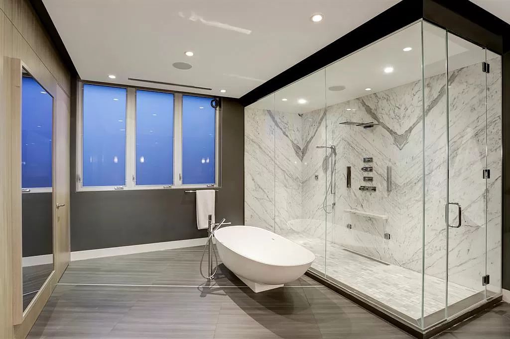 The masterful custom home in Houston offers modern contemporary detail and clean-line architecture mixed with the warmth of modern construction now available for sale. This home located at 4001 Ella Lee Ln, Houston, Texas; offering 4 bedrooms and 6 bathrooms with over 6,300 square feet of living spaces.