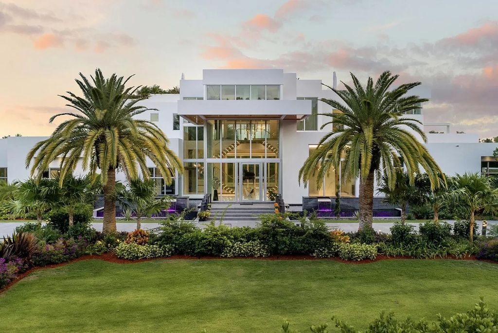 The Florida Contemporary Mansion is a luxurious masterpiece in the highly sought after enclave of Seminole Landing now available for sale. This home located at 1104 Seminole Blvd, North Palm Beach, Florida; offering 7 bedrooms and 8 bathrooms with over 17,000 square feet of living spaces. 