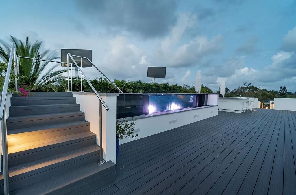 The Florida Contemporary Mansion is a luxurious masterpiece in the highly sought after enclave of Seminole Landing now available for sale. This home located at 1104 Seminole Blvd, North Palm Beach, Florida; offering 7 bedrooms and 8 bathrooms with over 17,000 square feet of living spaces. 