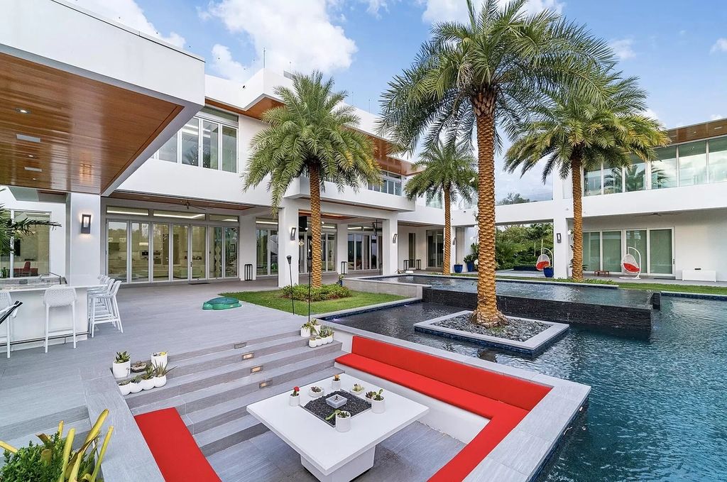 The Florida Contemporary Mansion is a luxurious masterpiece in the highly sought after enclave of Seminole Landing now available for sale. This home located at 1104 Seminole Blvd, North Palm Beach, Florida; offering 7 bedrooms and 8 bathrooms with over 17,000 square feet of living spaces. 