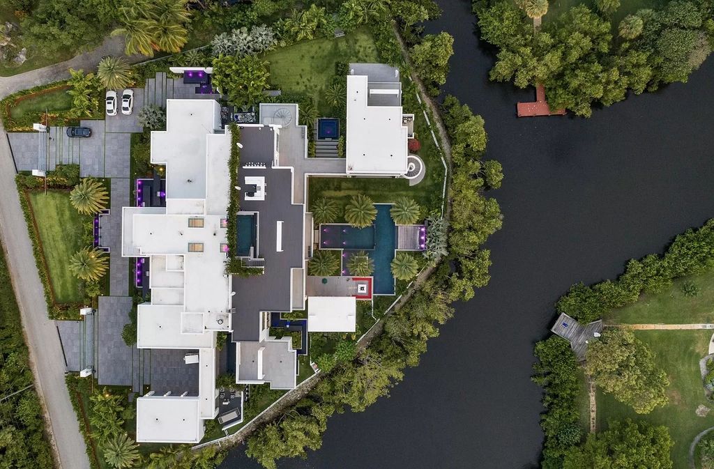 The Florida Contemporary Mansion is a luxurious masterpiece in the highly sought after enclave of Seminole Landing now available for sale. This home located at 1104 Seminole Blvd, North Palm Beach, Florida; offering 7 bedrooms and 8 bathrooms with over 17,000 square feet of living spaces. 