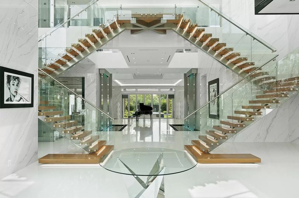 The Florida Contemporary Mansion is a luxurious masterpiece in the highly sought after enclave of Seminole Landing now available for sale. This home located at 1104 Seminole Blvd, North Palm Beach, Florida; offering 7 bedrooms and 8 bathrooms with over 17,000 square feet of living spaces. 