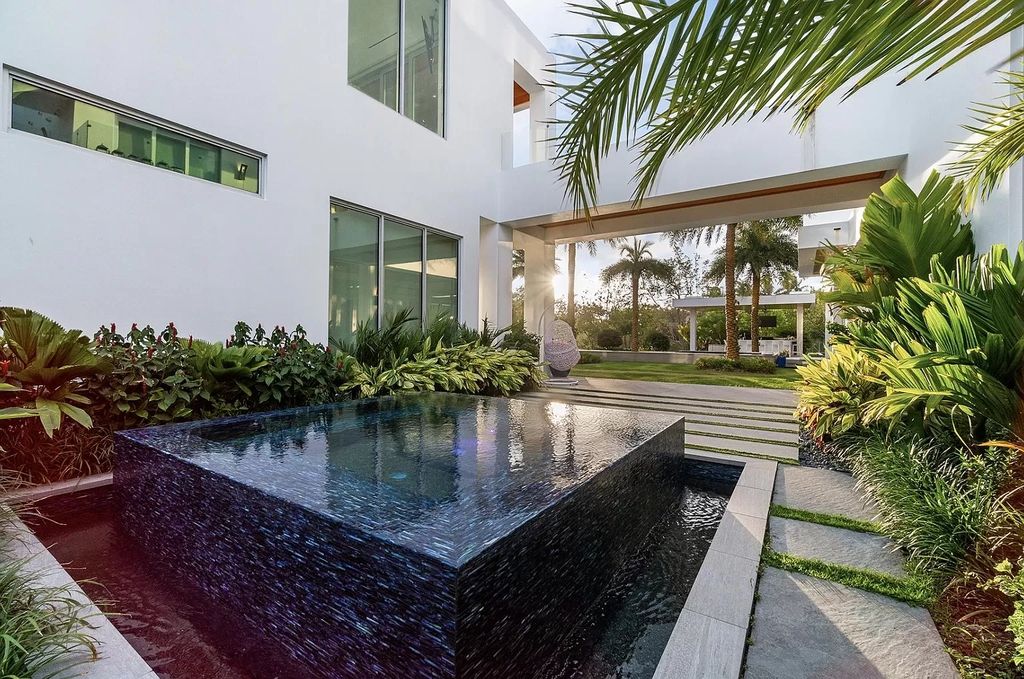 The Florida Contemporary Mansion is a luxurious masterpiece in the highly sought after enclave of Seminole Landing now available for sale. This home located at 1104 Seminole Blvd, North Palm Beach, Florida; offering 7 bedrooms and 8 bathrooms with over 17,000 square feet of living spaces. 