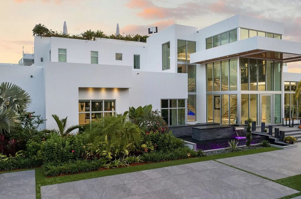 The Florida Contemporary Mansion is a luxurious masterpiece in the highly sought after enclave of Seminole Landing now available for sale. This home located at 1104 Seminole Blvd, North Palm Beach, Florida; offering 7 bedrooms and 8 bathrooms with over 17,000 square feet of living spaces. 