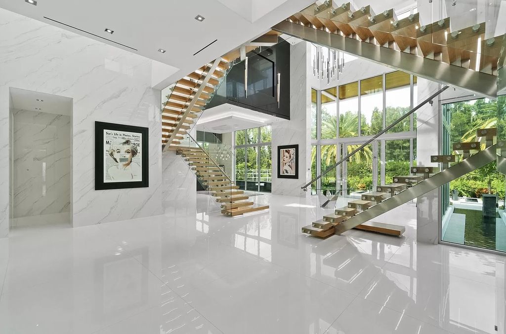 The Florida Contemporary Mansion is a luxurious masterpiece in the highly sought after enclave of Seminole Landing now available for sale. This home located at 1104 Seminole Blvd, North Palm Beach, Florida; offering 7 bedrooms and 8 bathrooms with over 17,000 square feet of living spaces. 