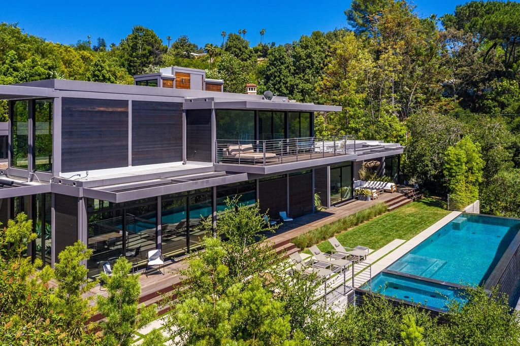 The Beverly Hills Home is a gated and secluded sanctuary with staggering vista views personifies quintessential California living now available for sale. This home located at 9321 Cherokee Ln, Beverly Hills, California; offering 5 bedrooms and 5 bathrooms with over 4,000 square feet of living spaces.