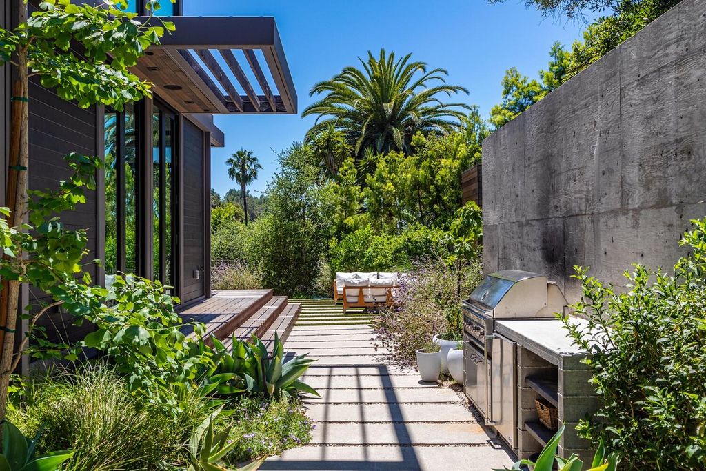 The Beverly Hills Home is a gated and secluded sanctuary with staggering vista views personifies quintessential California living now available for sale. This home located at 9321 Cherokee Ln, Beverly Hills, California; offering 5 bedrooms and 5 bathrooms with over 4,000 square feet of living spaces.