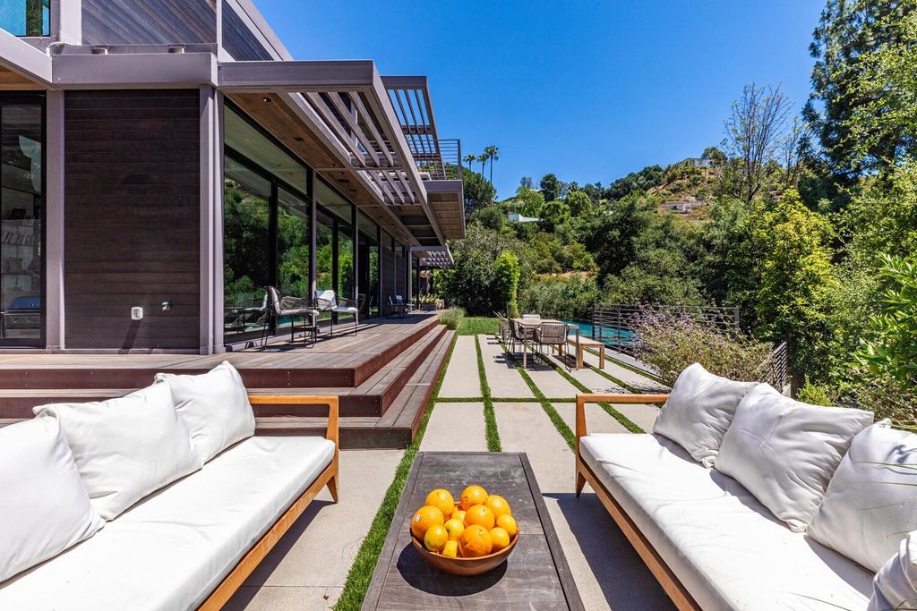 The Beverly Hills Home is a gated and secluded sanctuary with staggering vista views personifies quintessential California living now available for sale. This home located at 9321 Cherokee Ln, Beverly Hills, California; offering 5 bedrooms and 5 bathrooms with over 4,000 square feet of living spaces.