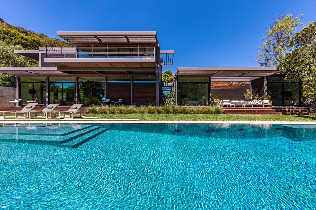 The Beverly Hills Home is a gated and secluded sanctuary with staggering vista views personifies quintessential California living now available for sale. This home located at 9321 Cherokee Ln, Beverly Hills, California; offering 5 bedrooms and 5 bathrooms with over 4,000 square feet of living spaces.