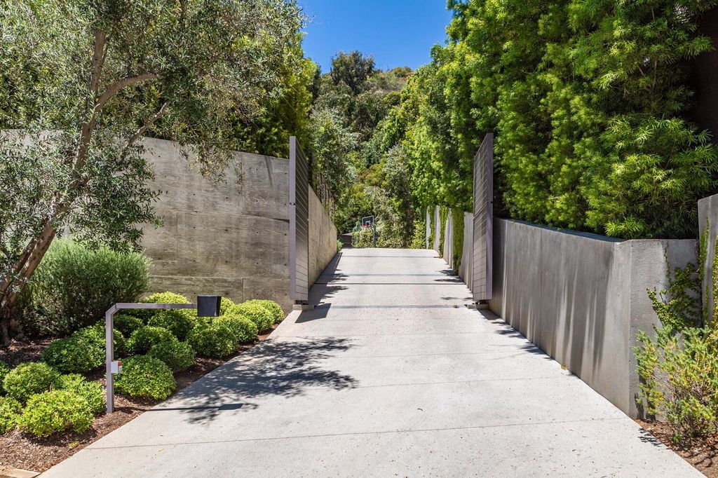 The Beverly Hills Home is a gated and secluded sanctuary with staggering vista views personifies quintessential California living now available for sale. This home located at 9321 Cherokee Ln, Beverly Hills, California; offering 5 bedrooms and 5 bathrooms with over 4,000 square feet of living spaces.