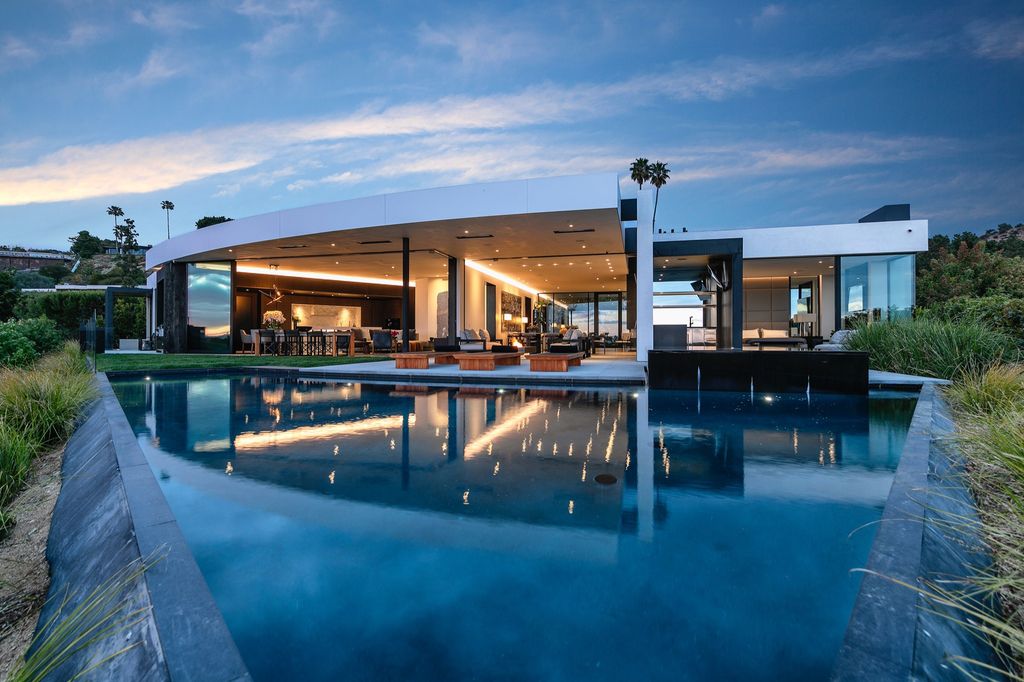 The Mansion in Beverly Hills is a spectacular hillside glass-walled sanctuary with Trousdale Estates most explosive panoramic city to ocean views now available for sale. This home located at 514 Chalette Dr, Beverly Hills, California; offering 6 bedrooms and 11 bathrooms with over 12,000 square feet of living spaces.