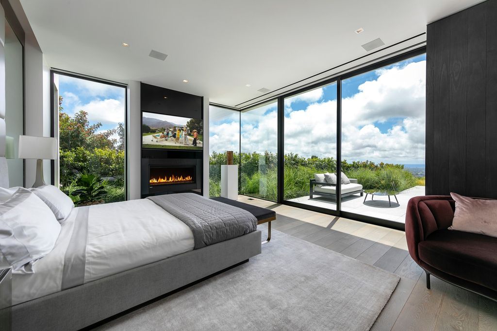 The Mansion in Beverly Hills is a spectacular hillside glass-walled sanctuary with Trousdale Estates most explosive panoramic city to ocean views now available for sale. This home located at 514 Chalette Dr, Beverly Hills, California; offering 6 bedrooms and 11 bathrooms with over 12,000 square feet of living spaces.