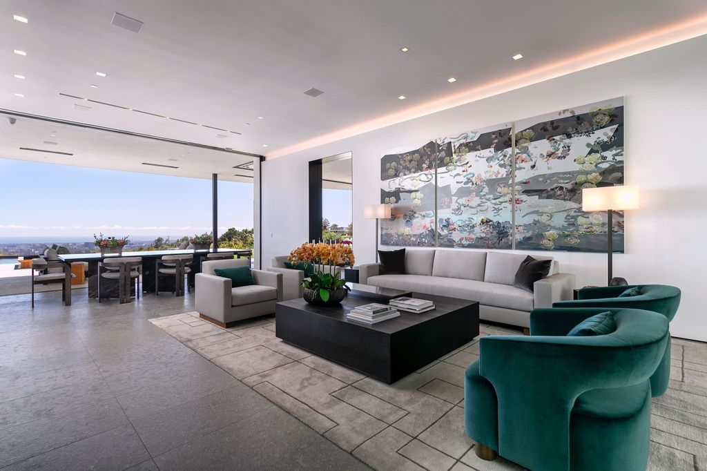 The Mansion in Beverly Hills is a spectacular hillside glass-walled sanctuary with Trousdale Estates most explosive panoramic city to ocean views now available for sale. This home located at 514 Chalette Dr, Beverly Hills, California; offering 6 bedrooms and 11 bathrooms with over 12,000 square feet of living spaces.