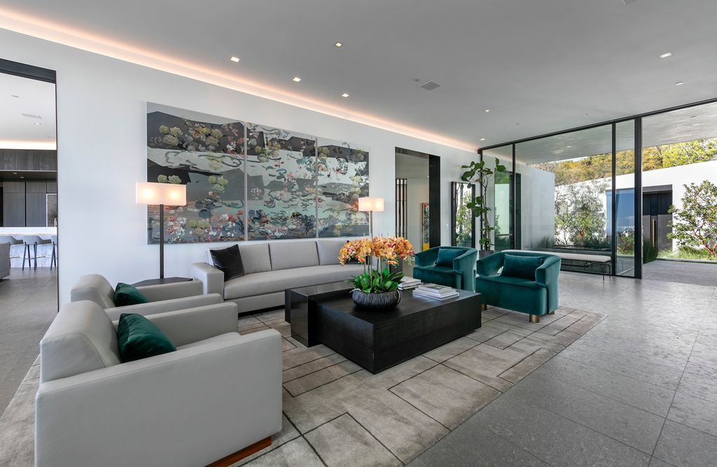 The Mansion in Beverly Hills is a spectacular hillside glass-walled sanctuary with Trousdale Estates most explosive panoramic city to ocean views now available for sale. This home located at 514 Chalette Dr, Beverly Hills, California; offering 6 bedrooms and 11 bathrooms with over 12,000 square feet of living spaces.