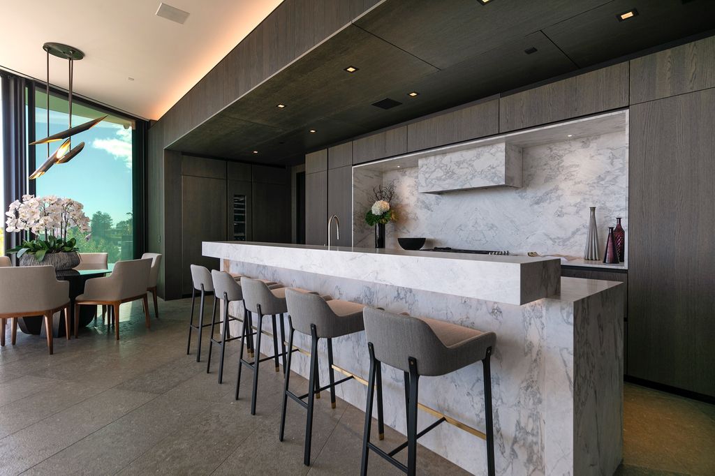 The Mansion in Beverly Hills is a spectacular hillside glass-walled sanctuary with Trousdale Estates most explosive panoramic city to ocean views now available for sale. This home located at 514 Chalette Dr, Beverly Hills, California; offering 6 bedrooms and 11 bathrooms with over 12,000 square feet of living spaces.
