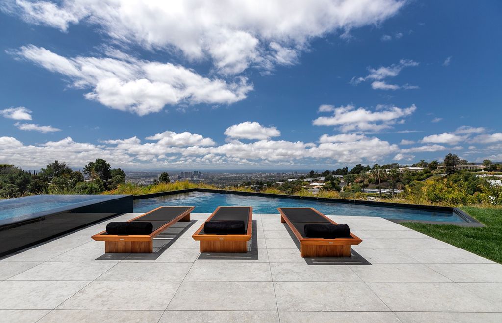 The Mansion in Beverly Hills is a spectacular hillside glass-walled sanctuary with Trousdale Estates most explosive panoramic city to ocean views now available for sale. This home located at 514 Chalette Dr, Beverly Hills, California; offering 6 bedrooms and 11 bathrooms with over 12,000 square feet of living spaces.
