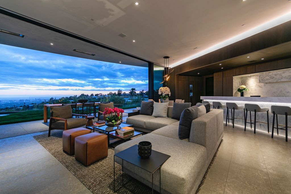 The Mansion in Beverly Hills is a spectacular hillside glass-walled sanctuary with Trousdale Estates most explosive panoramic city to ocean views now available for sale. This home located at 514 Chalette Dr, Beverly Hills, California; offering 6 bedrooms and 11 bathrooms with over 12,000 square feet of living spaces.