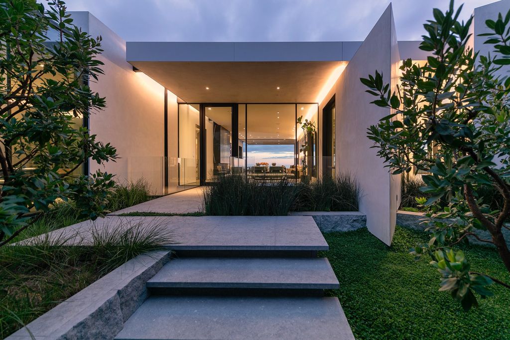 The Mansion in Beverly Hills is a spectacular hillside glass-walled sanctuary with Trousdale Estates most explosive panoramic city to ocean views now available for sale. This home located at 514 Chalette Dr, Beverly Hills, California; offering 6 bedrooms and 11 bathrooms with over 12,000 square feet of living spaces.