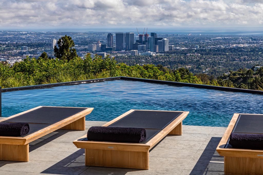 The Mansion in Beverly Hills is a spectacular hillside glass-walled sanctuary with Trousdale Estates most explosive panoramic city to ocean views now available for sale. This home located at 514 Chalette Dr, Beverly Hills, California; offering 6 bedrooms and 11 bathrooms with over 12,000 square feet of living spaces.
