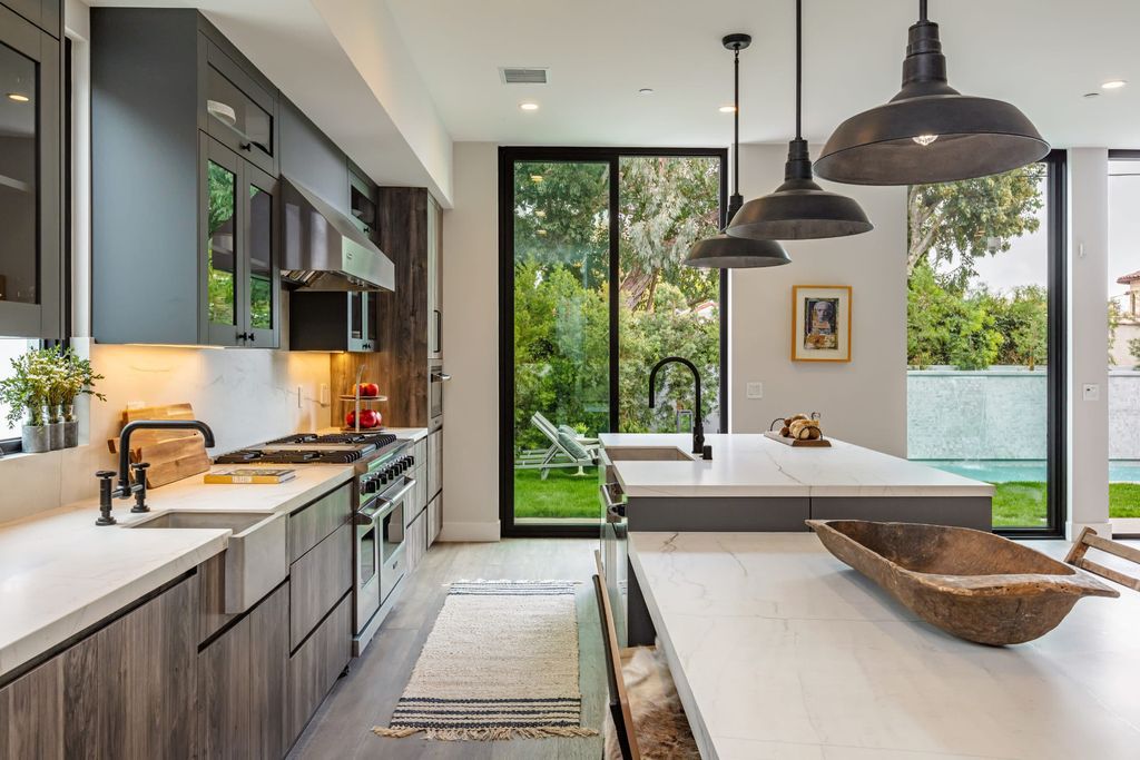 The Modern Farmhouse in Beverly Hills is a timeless, architectural custom-built estate with exclusive, high-end designer finishes now available for sale. This home located at 220 S Wetherly Dr, Beverly Hills, California