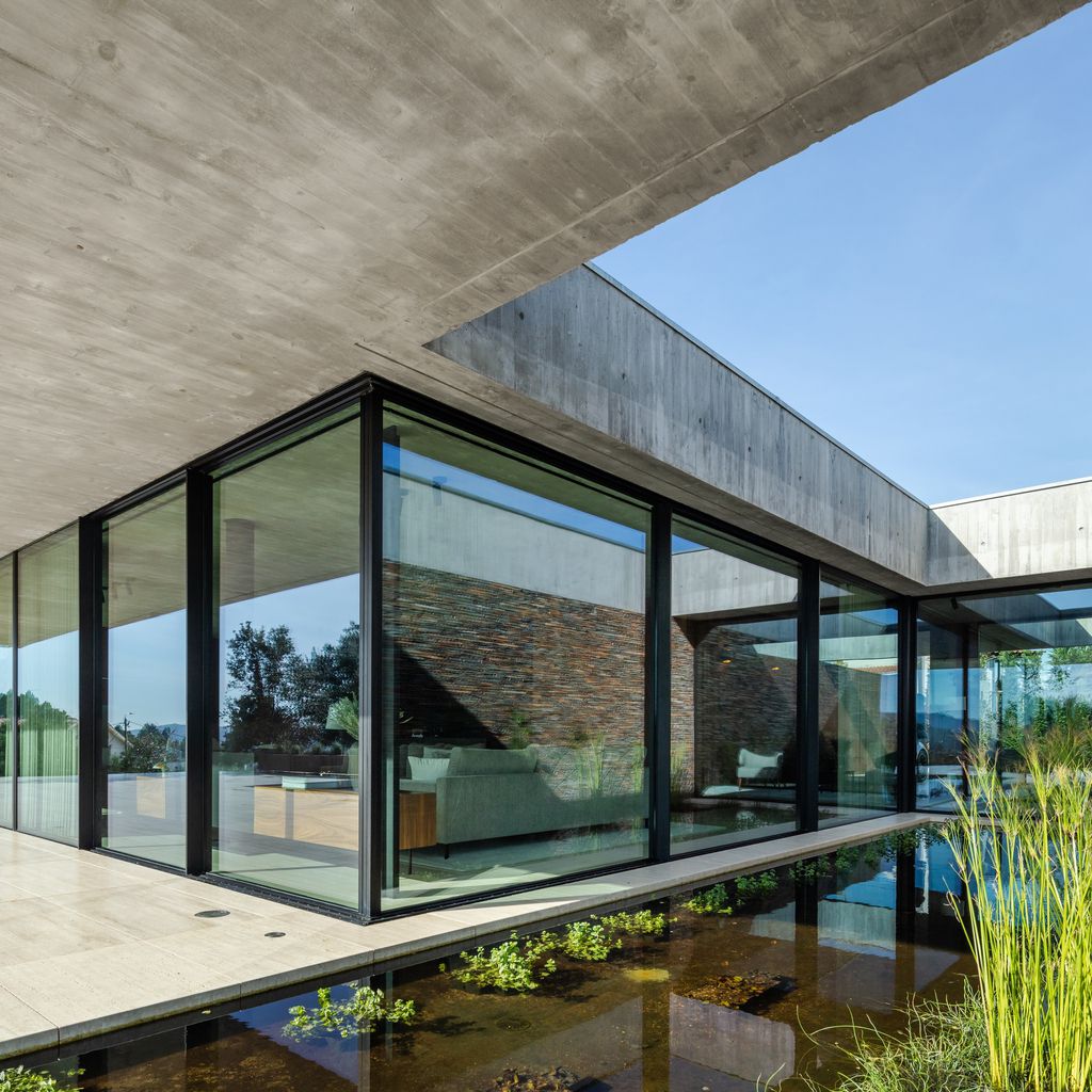 Cork Trees House by Trama Arquitetos a Raw concrete floats over Horizon 10