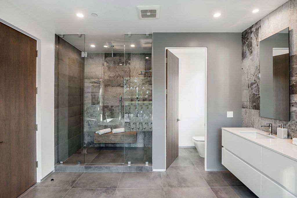 This Flawless Modern Home in Studio City was built and designed by the famous Arzuman Brothers. The house is seamlessly blending exquisite design, and an impeccable choice of quality materials as well as embracing the security and convenience of today’s most up-to-date technology